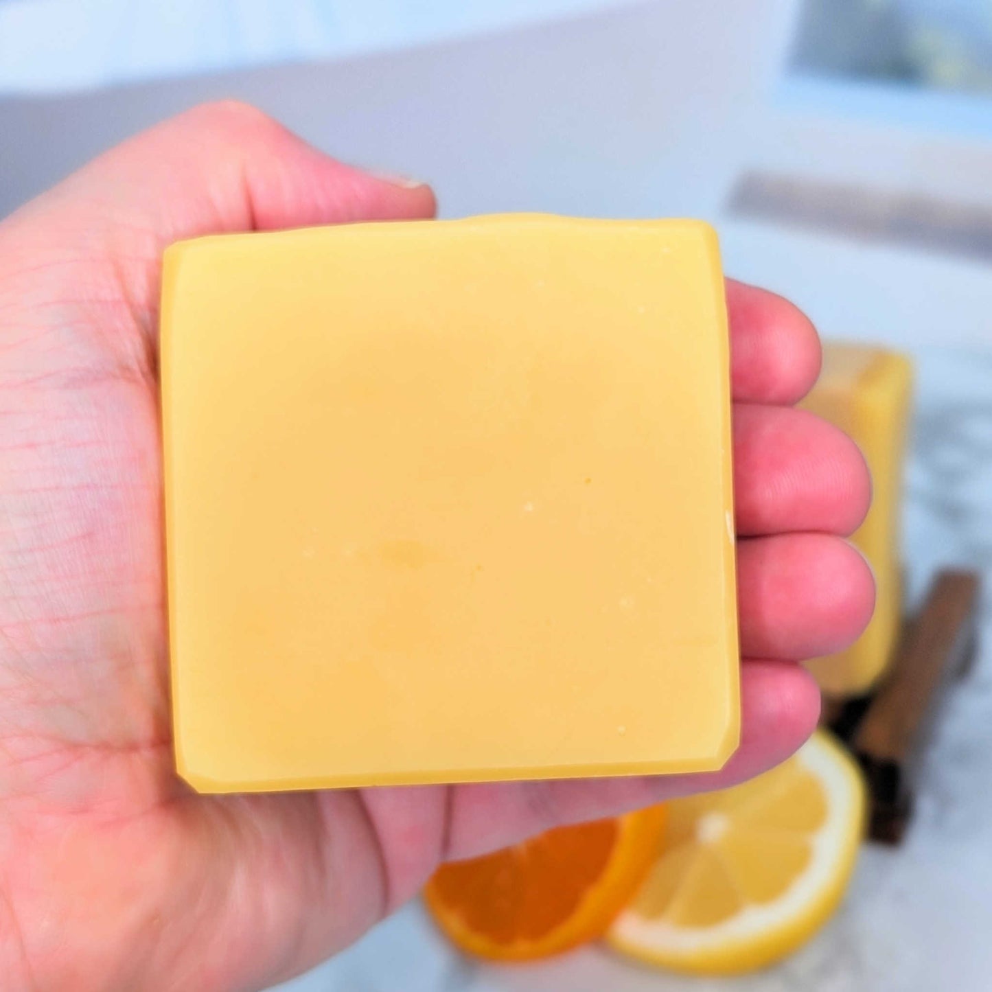 all natural handmade cirtus shampoo bar for normal hair in hand