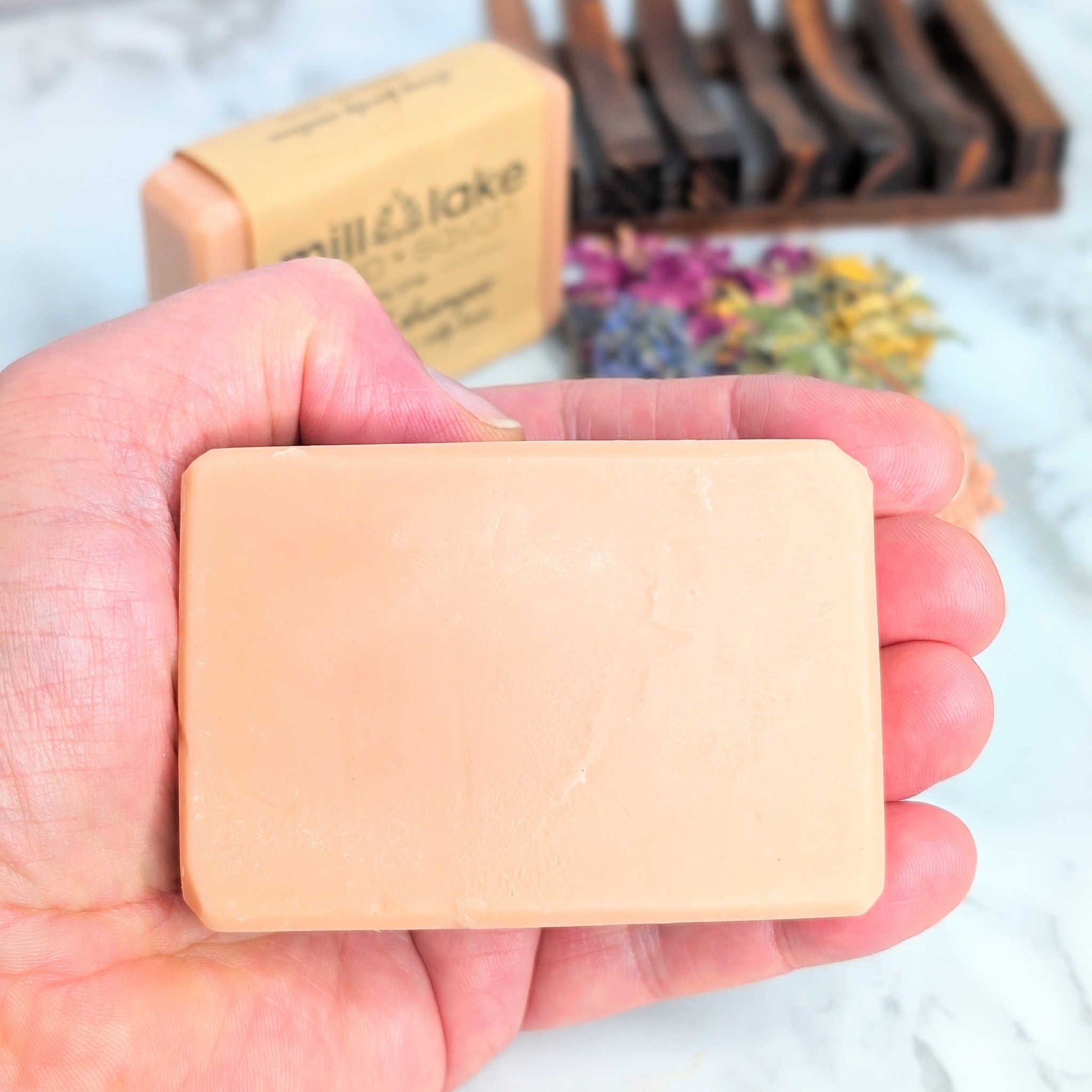 all natural handmade floral shampoo bar for oily hair in hand