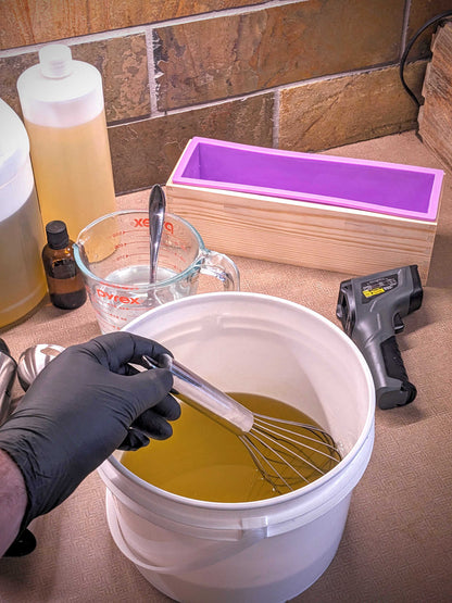 hand mixing all natural soap