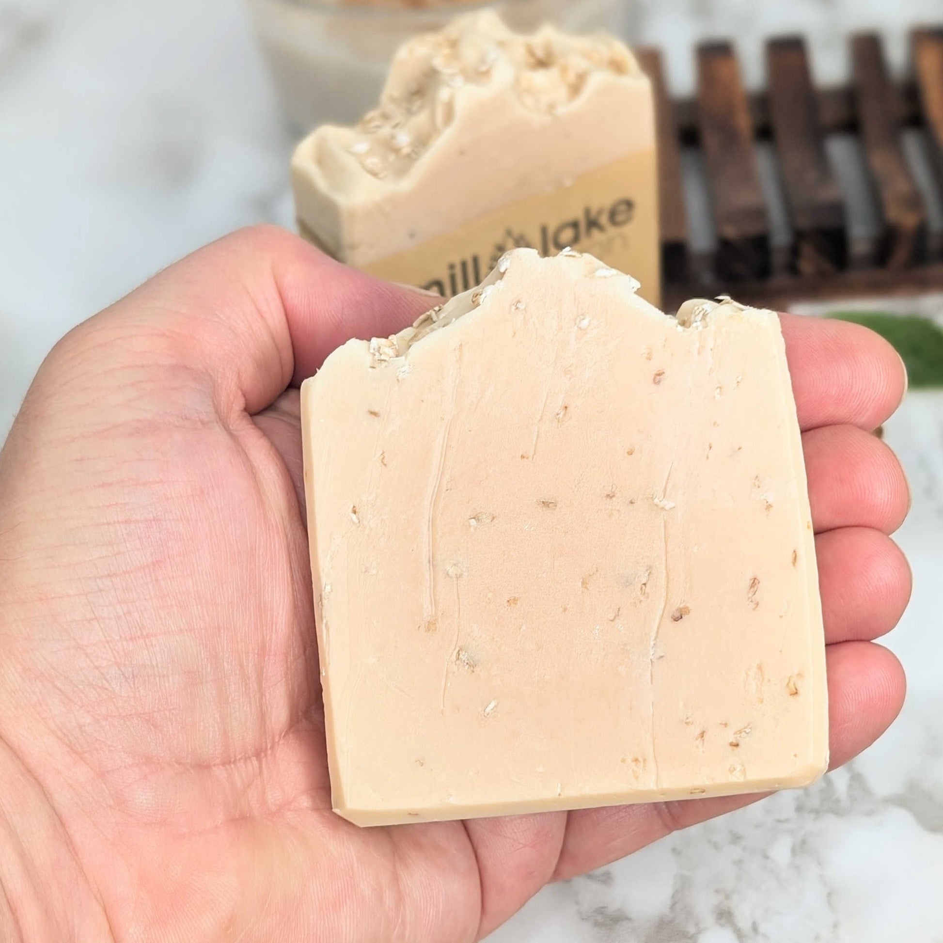 all natural handmade oatmeal milk and honey bath soap in hand