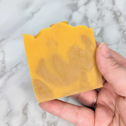 orange spice soap in hand